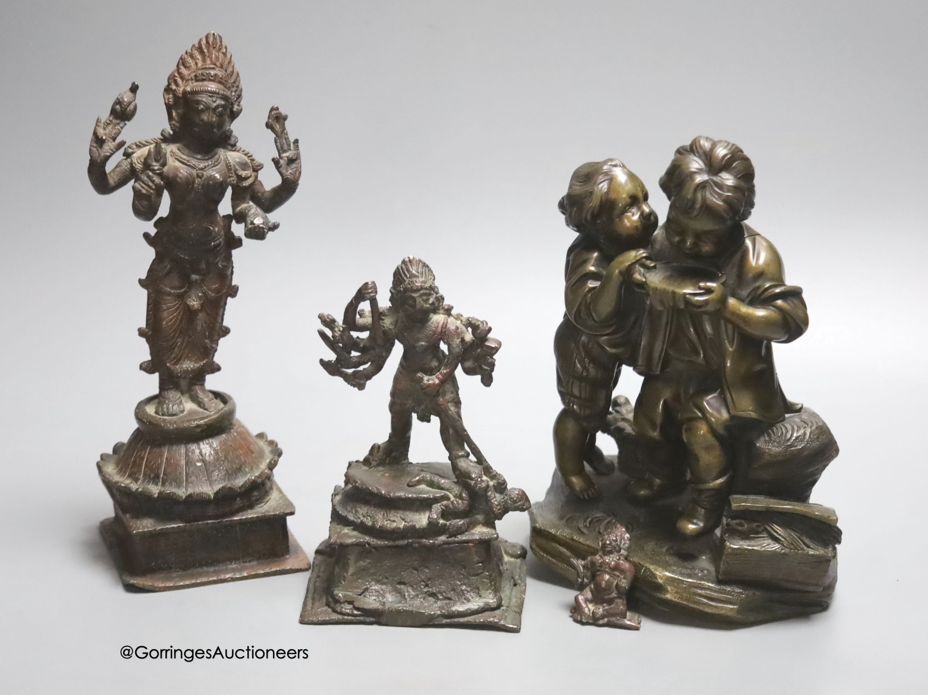 A bronze group of two children and two Indian bronze figures, tallest 20cm